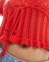 ASOS DESIGN knitted milkmaid top in open stitch with tie waist in red