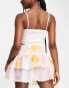 ASOS DESIGN tiered button front mini skirt with scalloped hem in washed floral