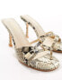 Public Desire Twisted heeled mule with padlock in natural snake