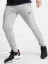 Nike Training Dri-FIT tapered joggers in light grey