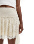 ASOS DESIGN asymmetric hem lace mini skirt with ruched waist in ivory