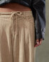 Lioness corduroy slouchy low rise tie detail wide leg trousers in beige