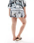 ASOS DESIGN Curve satin co-ord short in newspaper print