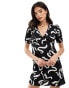 Wednesday's Girl v-neck short sleeve mini dress in black and white swirl