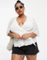 ASOS DESIGN Curve dobby wrap short sleeve blouse with pleated peplum hem in ivory