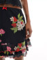 Reclaimed Vintage mini skirt with bows in black vintage floral and fruit print