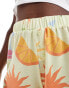 ASOS DESIGN holiday print boxer shorts in soft yellow