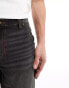 ASOS DESIGN tapered fit jeans with carpenter detail in washed black