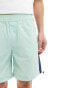 ASOS DESIGN nylon short in mint and navy side panels