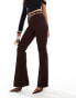 ASOS DESIGN rib slim flare trousers with back vent and gold belt in chocolate