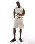 ASOS DESIGN knitted crochet polo with contrast sleeves in stone and khaki